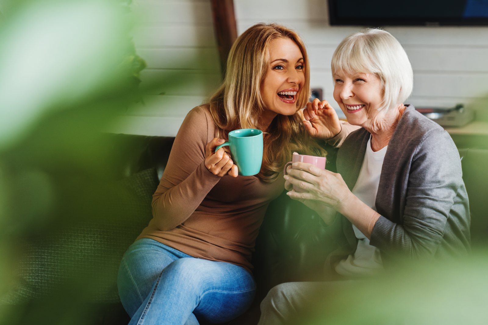 Two generations sharing coffee and laughter — community life in Kemptville